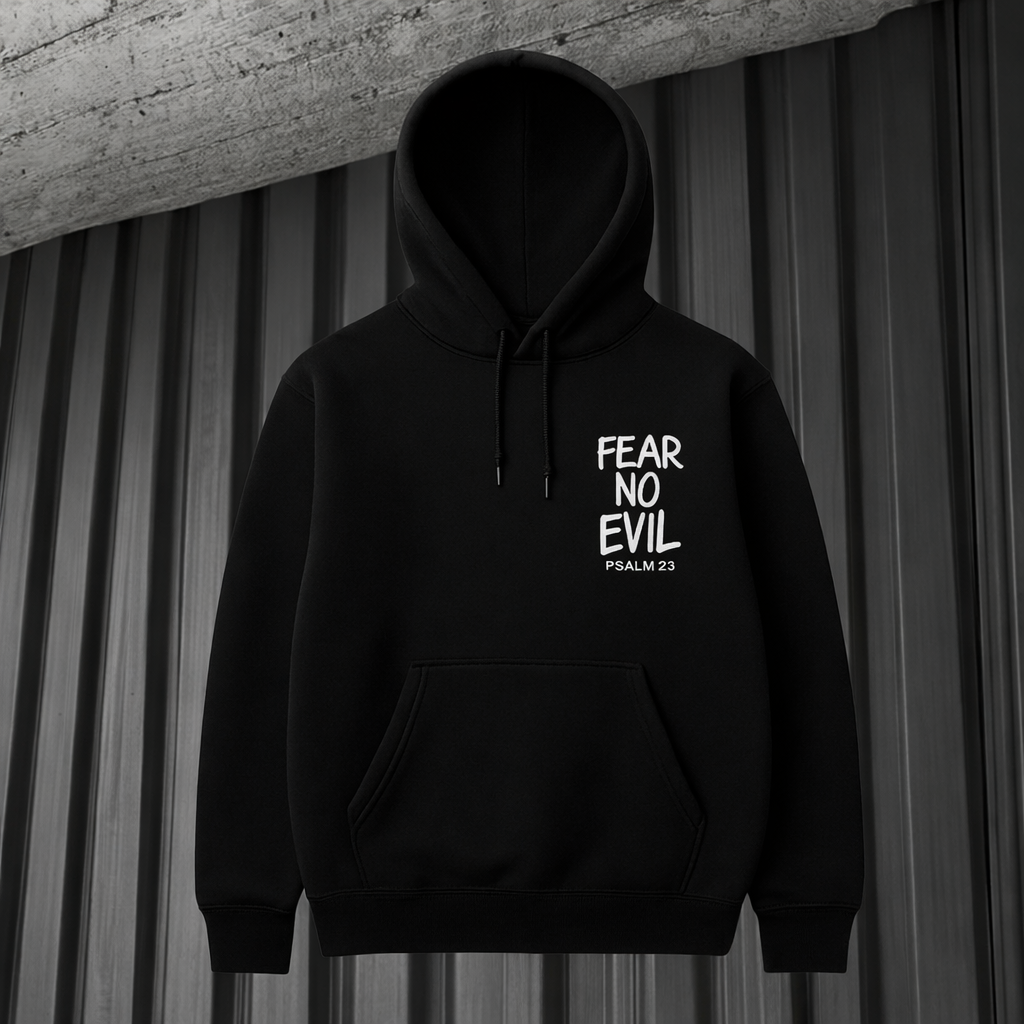Black hoodie with 'Fear No Evil' text on a gray curtain background